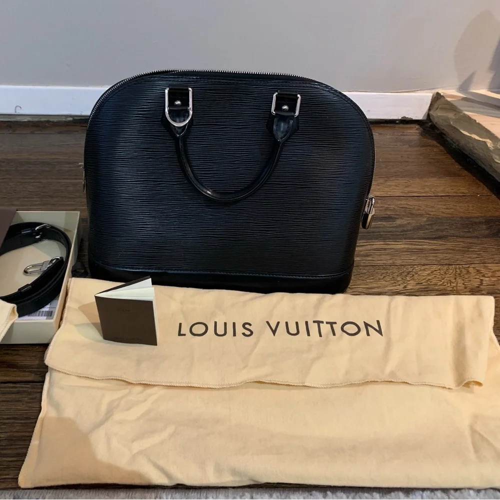 Louis Vuitton Alma Black Epi Leather Handbag.Authenticity
Guaranteed by Poshmark - Picture 1 of 10
